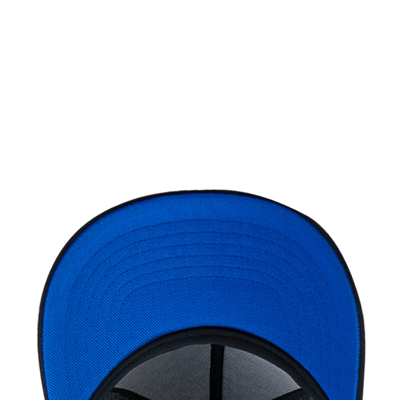 Blue interior of snapback cap with black seam and stitched panel