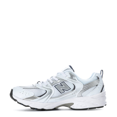 Kids white running sneaker side profile with large N logo and lace-up