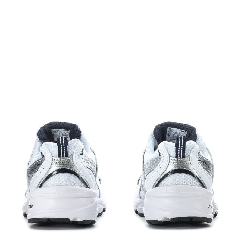 Kids white sneakers heel view with navy trim, cushioned collar and lace-up