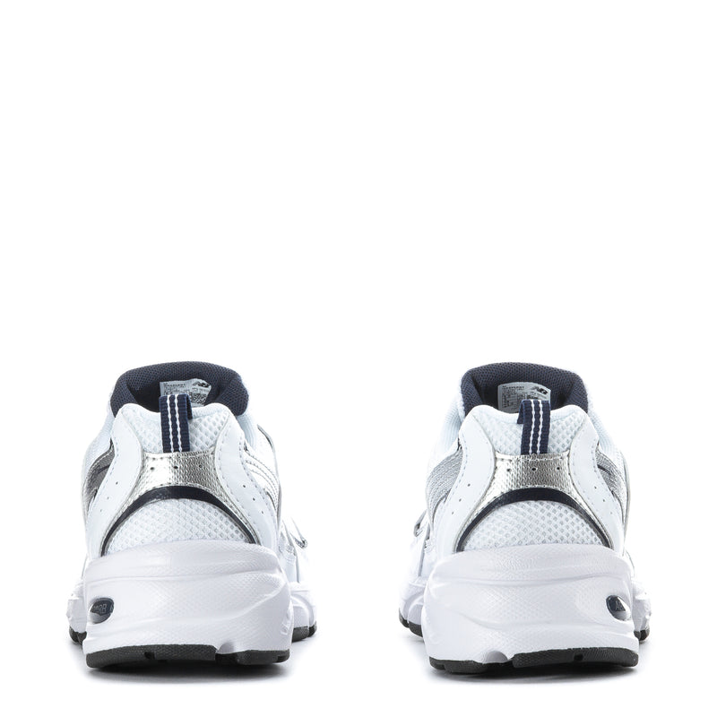 White youth sneaker heel view with lace-up closure and padded back collar