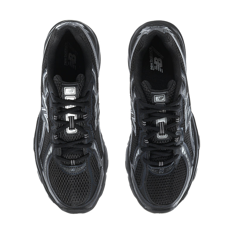 Men's black lace-up running shoes showing mesh panels and tongue, silver N logo details