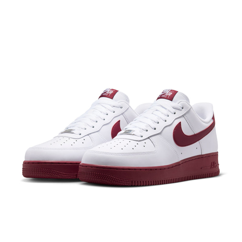 Pair of men's Nike Air Force 1 low-top sneakers in white with Team Red Swoosh