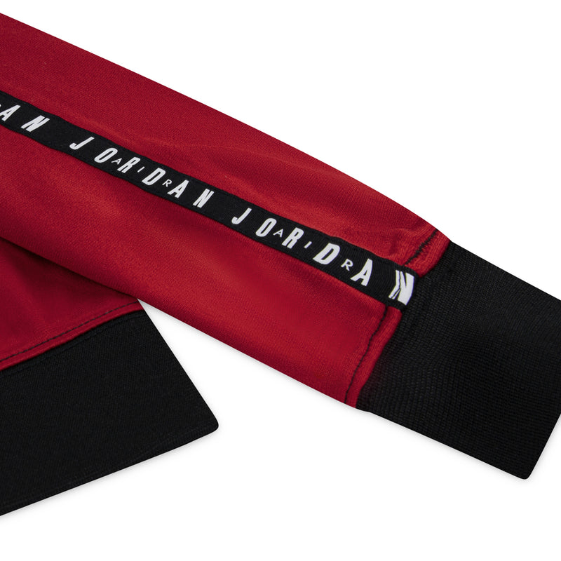 Red and black ribbed cuff with repeated JORDAN lettering