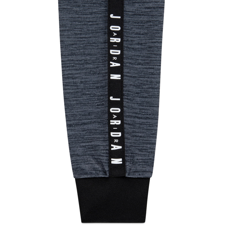 Grey jogger cuff with black ribbed hem and vertical JORDAN tape on leg.