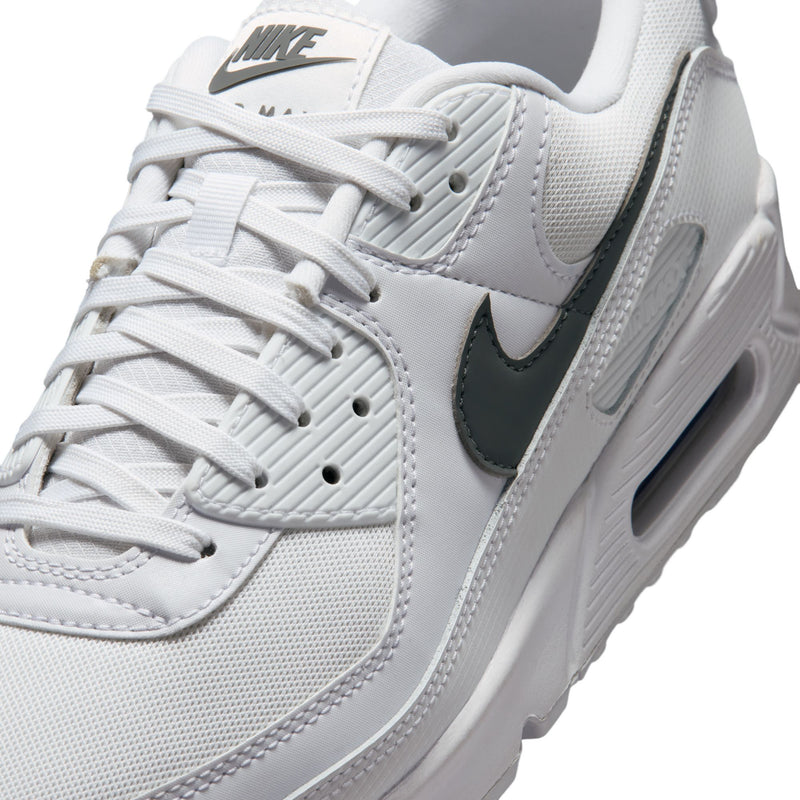Men's Air Max 90 sneakers upper close-up, white mesh with dark swoosh on side
