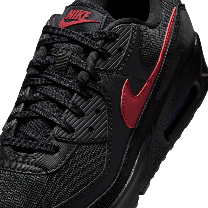 Nike Air Max 90 men's sneaker close-up, black upper with red swoosh and laces