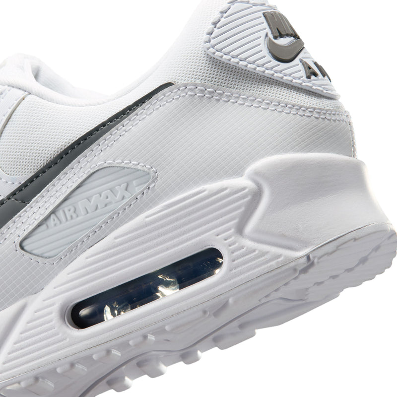 Men's Air Max 90 sneakers midsole close-up, clear air unit in white rubber