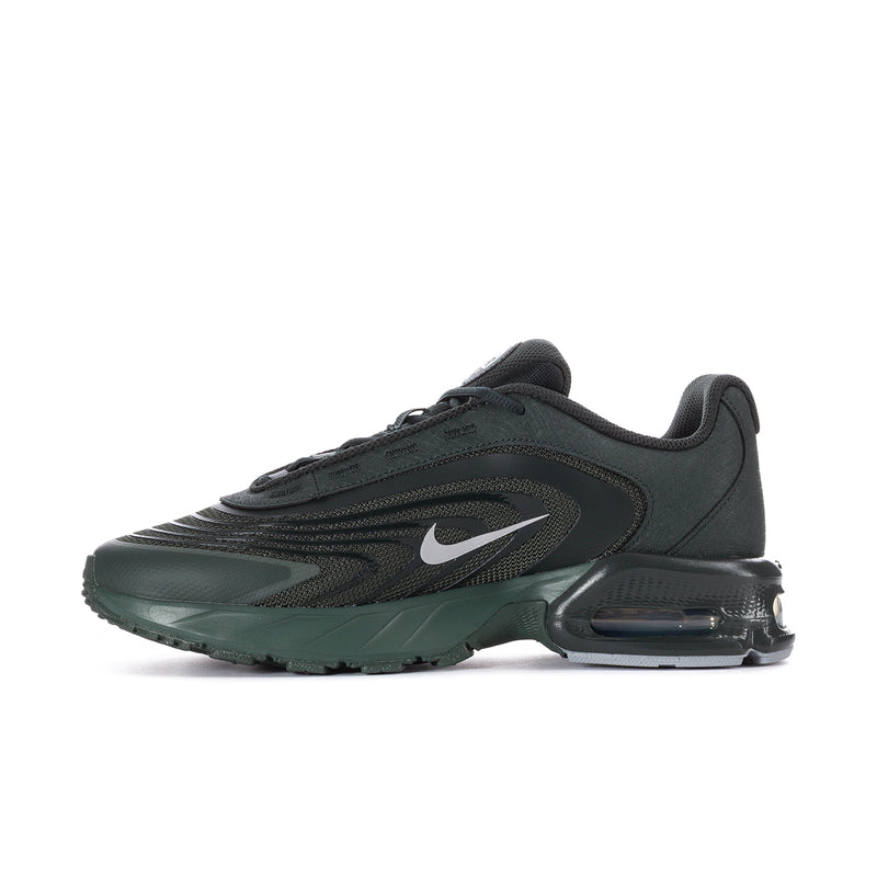 Men's running shoe angled side view, dark green and black with white Swoosh and air unit