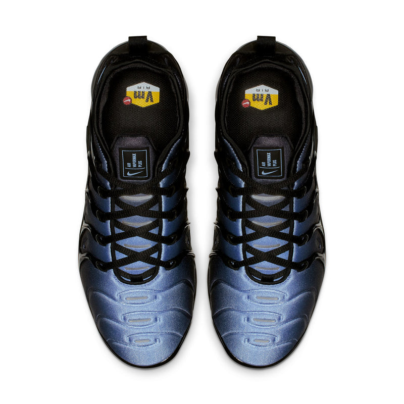 Pair of sneakers with black tongues, blue accents, and lace-up collar