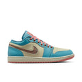 Men's low-top sneakers in teal, tan, and salmon with pink laces and Nike swoosh