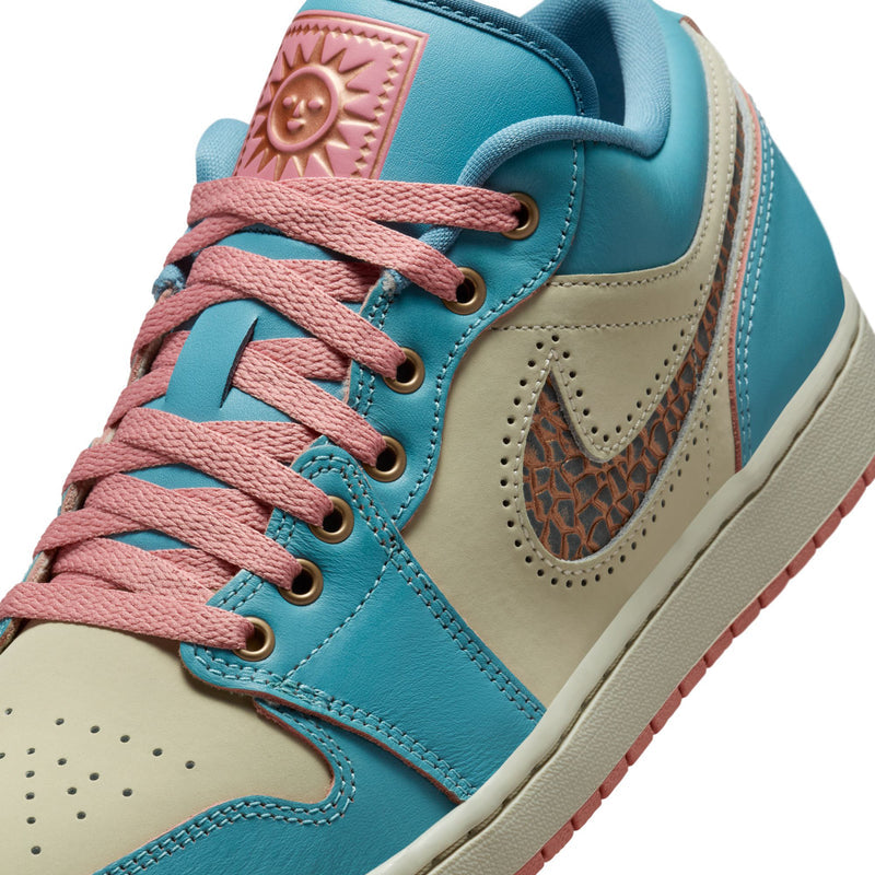 Men's low-top sneaker close-up with teal leather, tan panel, and pink lace