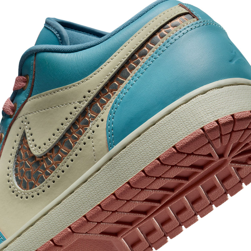 Men's low-top sneaker close-up of side with teal leather, tan Swoosh, brown/red detail