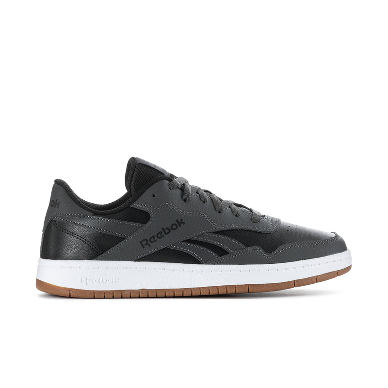 Men's Reebok low-top sneakers in black with white midsole and gum outsole