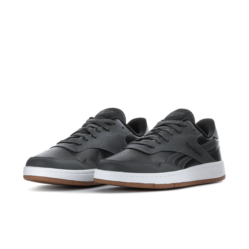 Men's Reebok low-top sneakers lace-up in black/grey with gum outsole and white sole