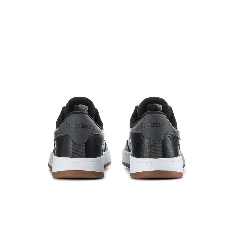 Men's Reebok low-top sneakers rear view, black heel tab and white stripe