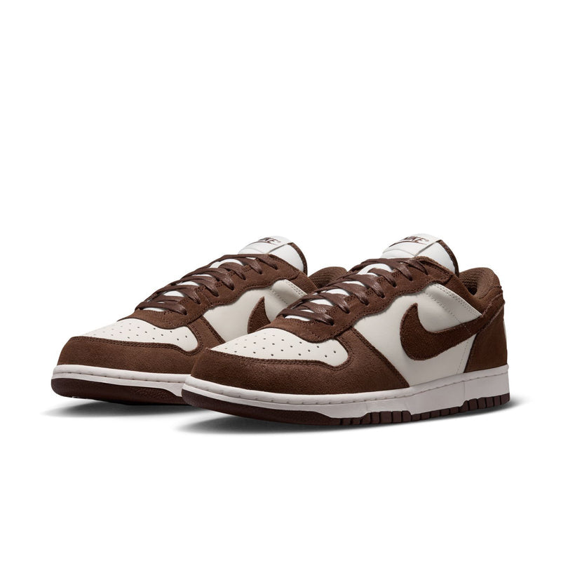Pair of men's low-top Nike sneakers in brown and white with brown laces and padded collar