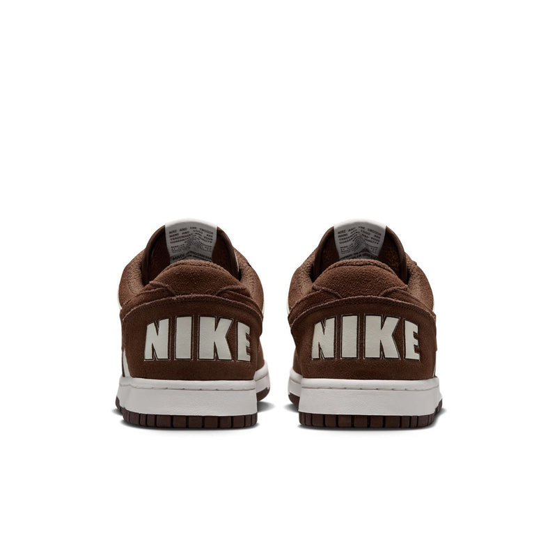 Men's low-top Nike sneakers from heel view with bold NIKE text on back and brown sole