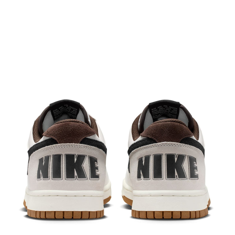 Nike low-top sneakers from the back, white uppers with black heel accents