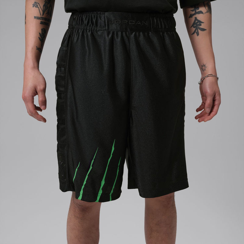 Men's black shorts with green graphic stripe on front and elastic waistband