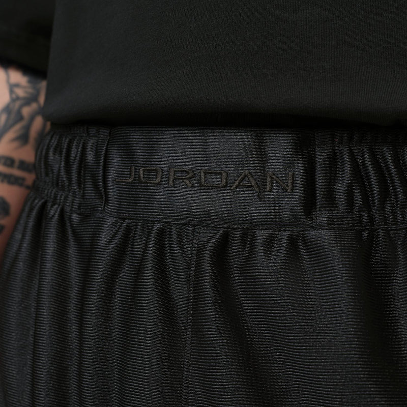 Men's black shorts close-up of elastic waistband with Jordan logo