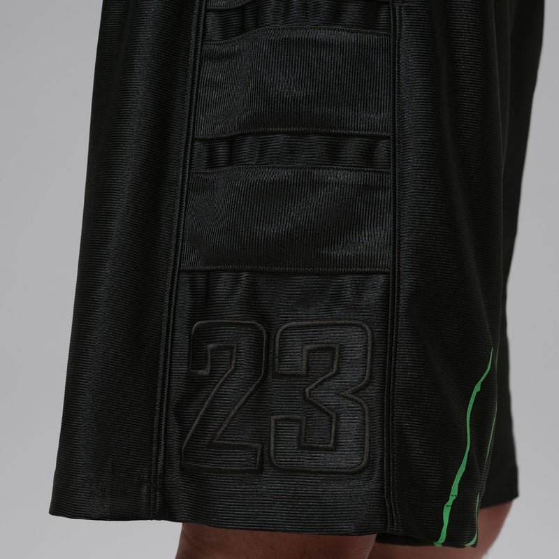 Men's black shorts with raised 23 logo patch and green stripe accent