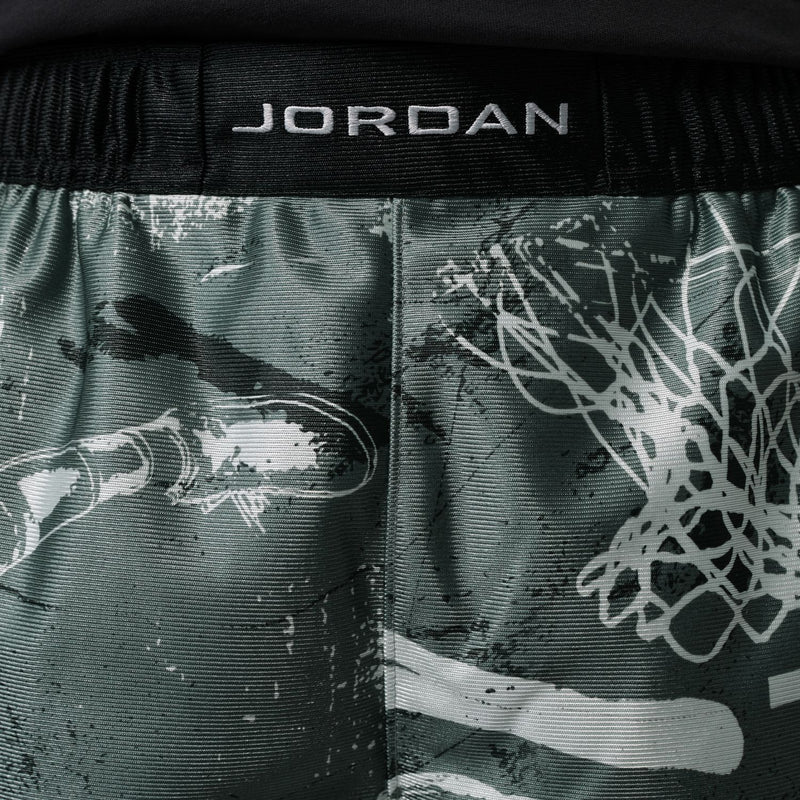 Dark green shorts with white splatter and animal face graphic print