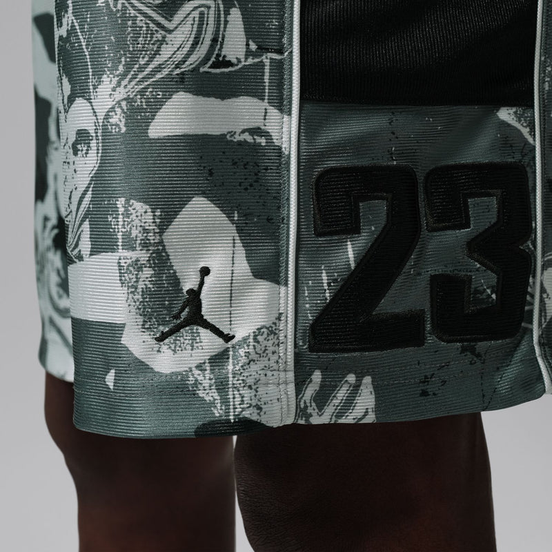 Dark green shorts with white Jumpman and 23 graphic, black elastic waistband