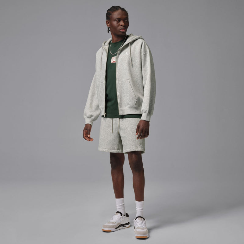 Heather grey men's fleece shorts on model, above-knee length