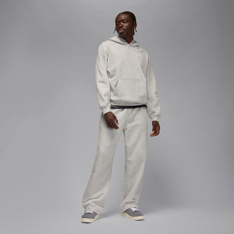 Men's heather grey oversized sweatpants with cuffed hems and elastic waist