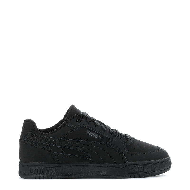 Puma youth low-top sneakers in black with suede-style panels and lace-up design
