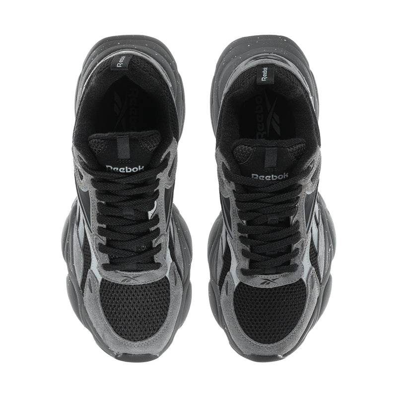 Men's grey and black lace-up running sneakers, close-up of tongues and uppers