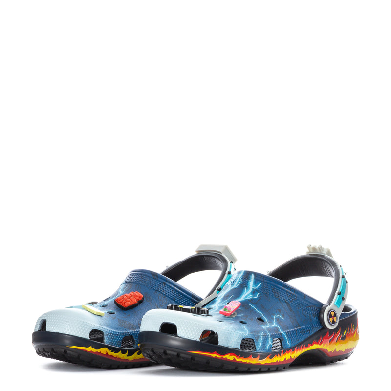 Men's blue clogs with lightning pattern, flame trim, and back heel strap detail