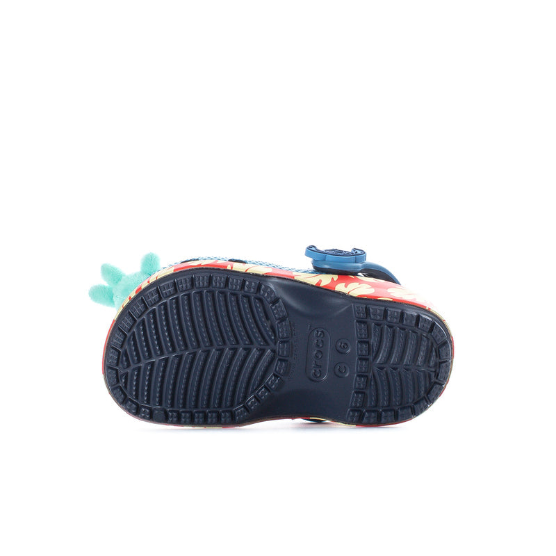 Toddler blue clog outsoles with textured tread on dark blue rubber sole