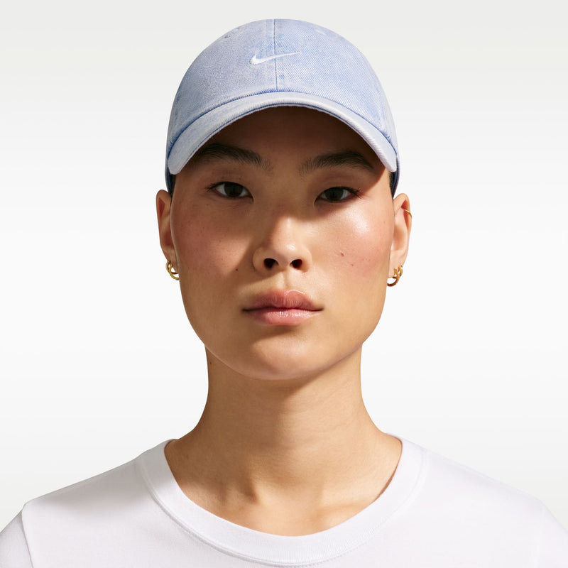 Light blue denim Nike unstructured cap with white swoosh and curved brim