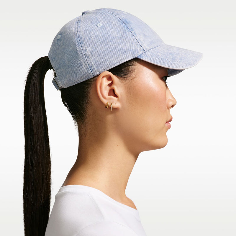 Light blue denim Nike unstructured cap, side profile with white swoosh