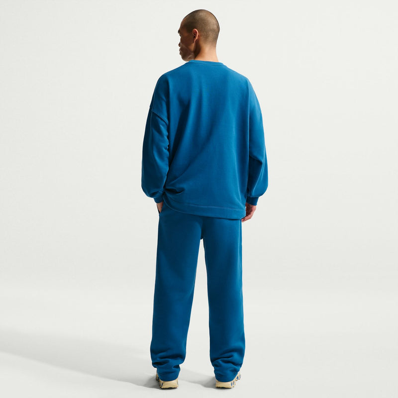 Men's court blue fleece open-hem pants from behind with elastic waistband and cuffs