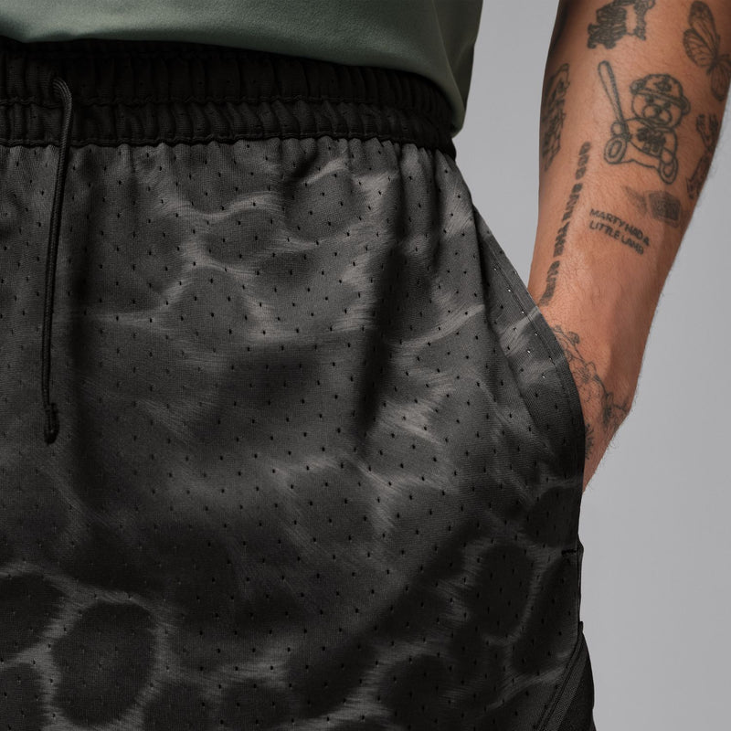 Men's black diamond-print athletic shorts with elastic waistband and side seam detail