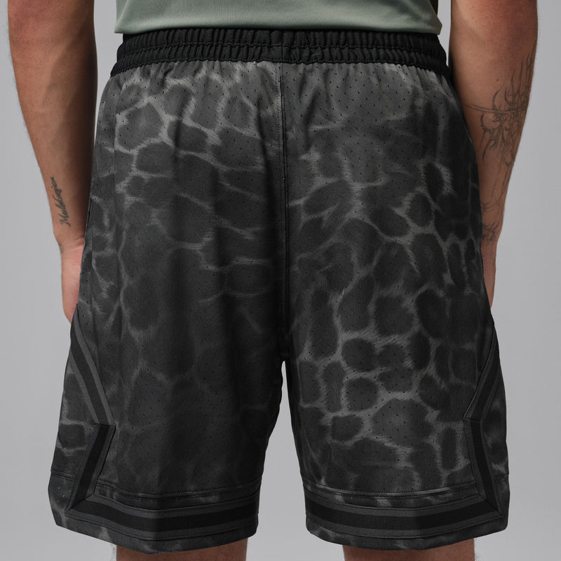Men's black diamond-pattern athletic shorts, rear view with stitched hem panels