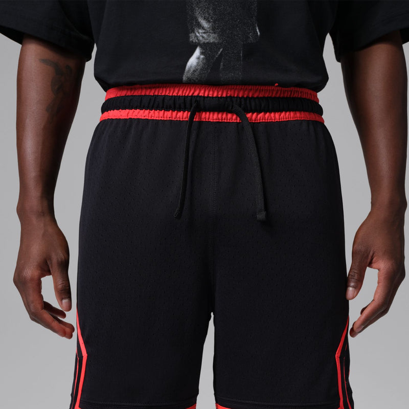 Men's black athletic shorts with drawstring, red waistband, and red side piping