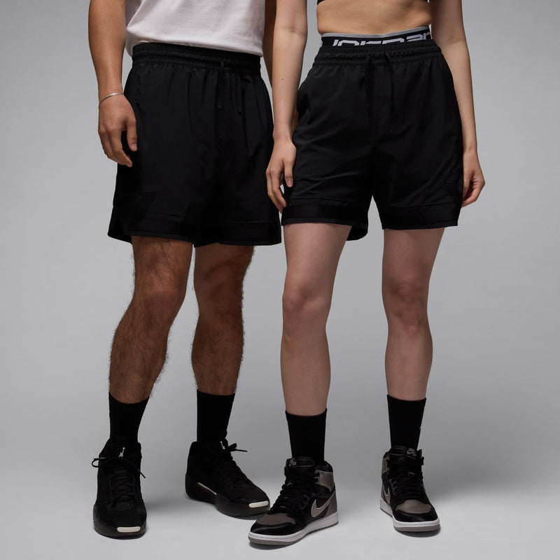 Men's black woven shorts with elastic waistband and drawstring, knee-length