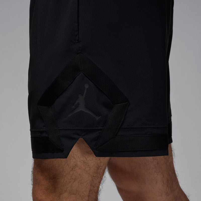 Men's black woven shorts with diamond-shaped fabric overlay at the back hem