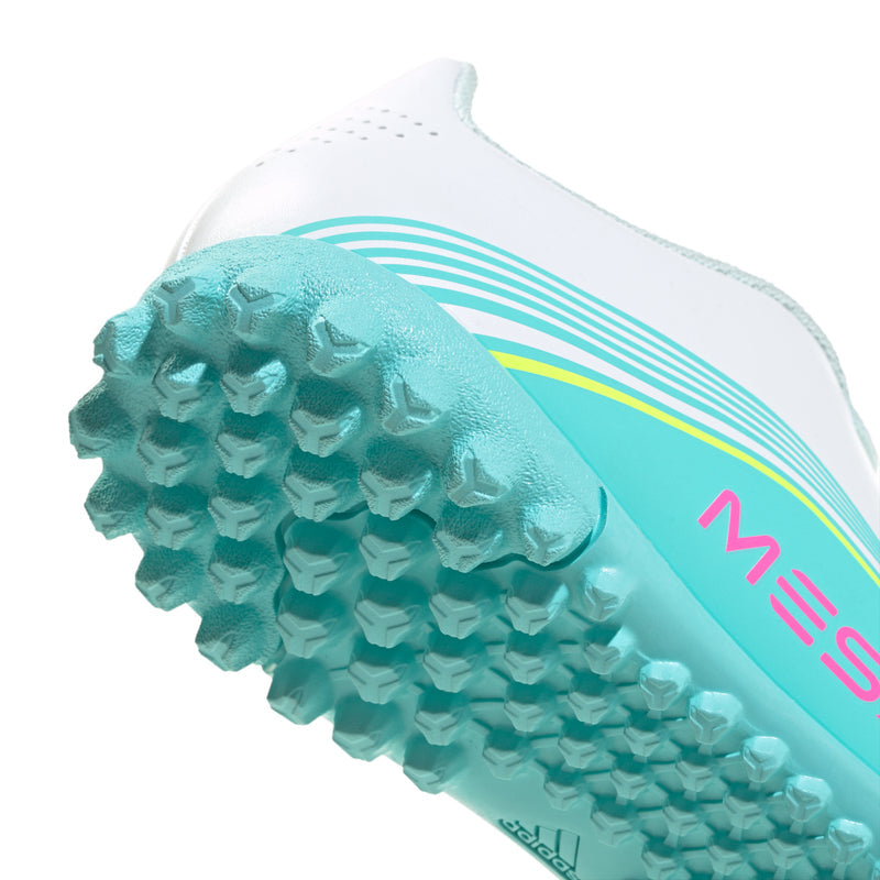 Kids soccer cleat toe and tread, aqua studded outsole with white upper and teal stripes