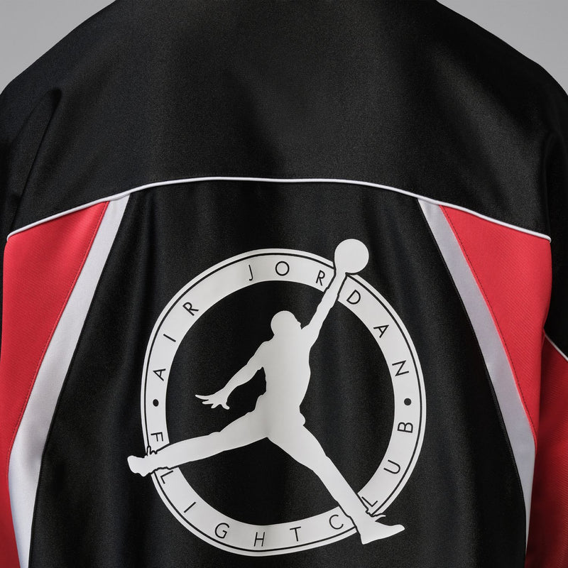 Men's black jersey back graphic with Jumpman silhouette inside circular Flight Club logo