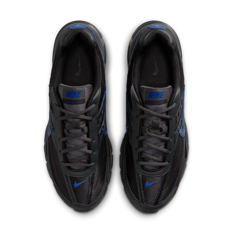 Men's black lace-up running shoes, tongue label and Nike swoosh visible