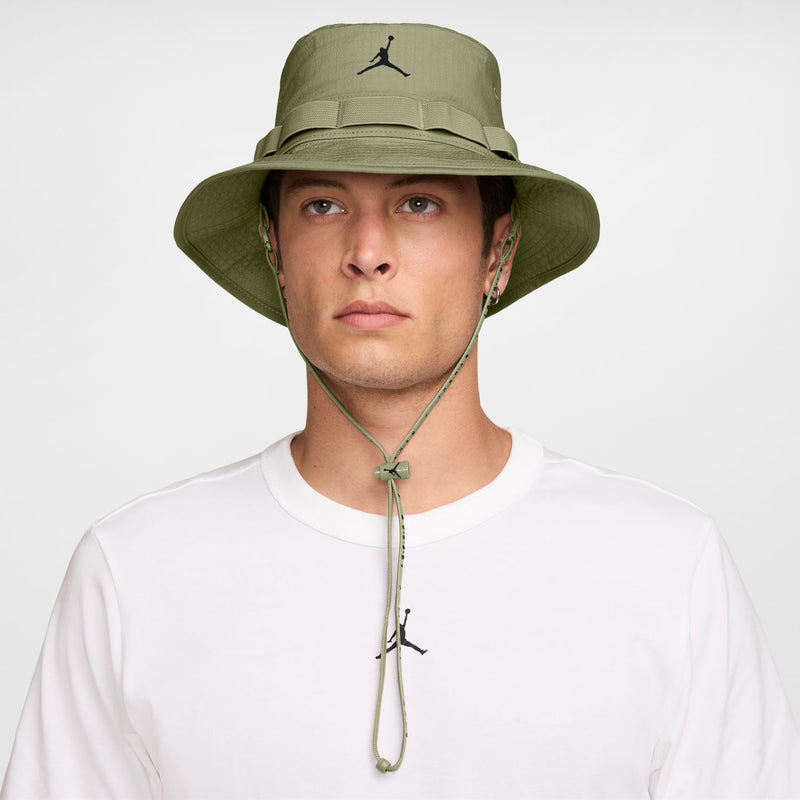 Olive green bucket hat with black Jumpman logo, chin strap and eyelet details