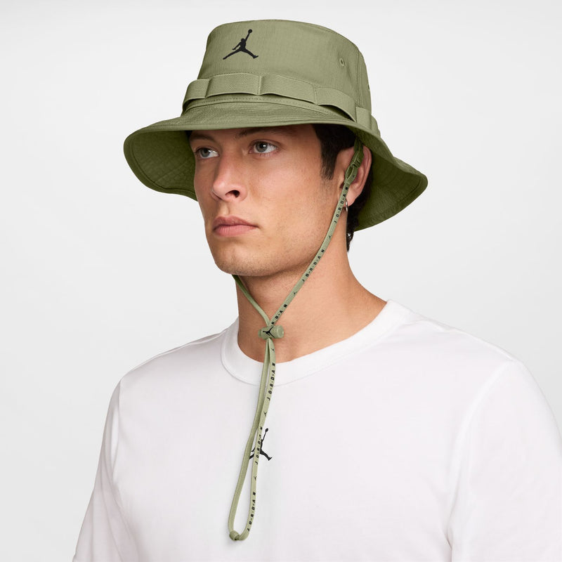 Olive green Jordan bucket hat with black Jumpman logo and dangling chin cord