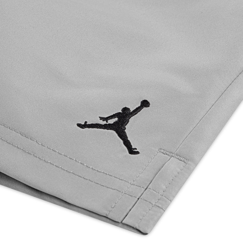 Light gray shorts hem with black Jumpman logo and visible stitching