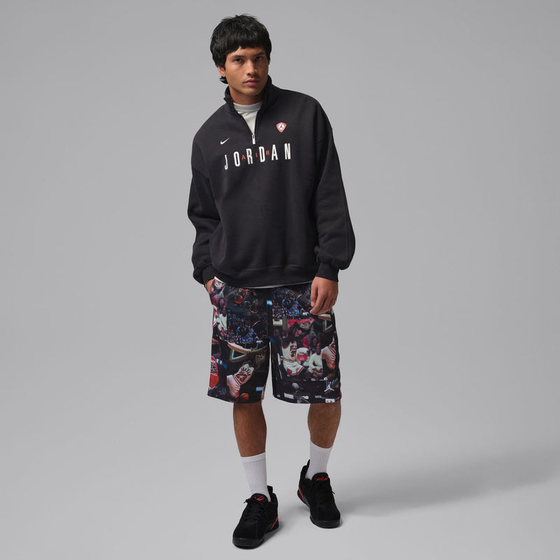 Black mesh basketball print shorts with elastic waistband and colorful all-over graphic