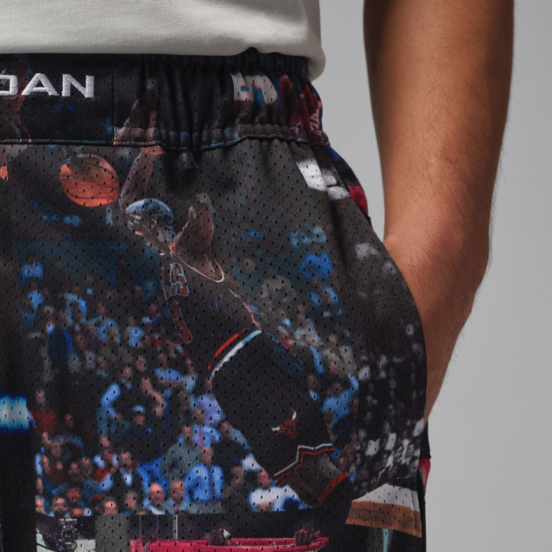 Black mesh basketball print shorts detail with elastic waistband and curved side seam
