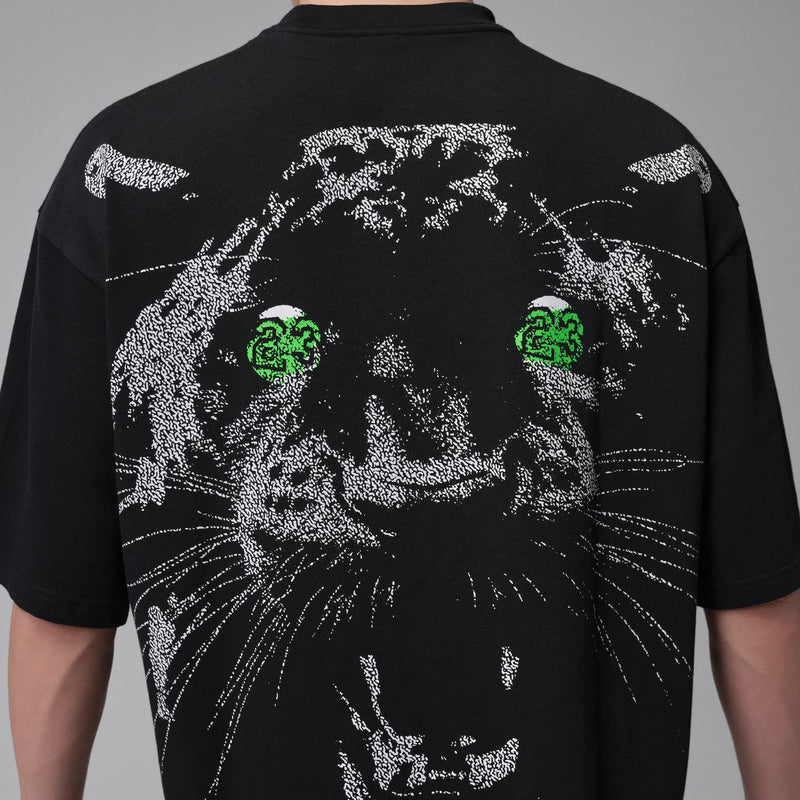 Men's black oversized crewneck T-shirt with detailed cat face graphic, green eyes